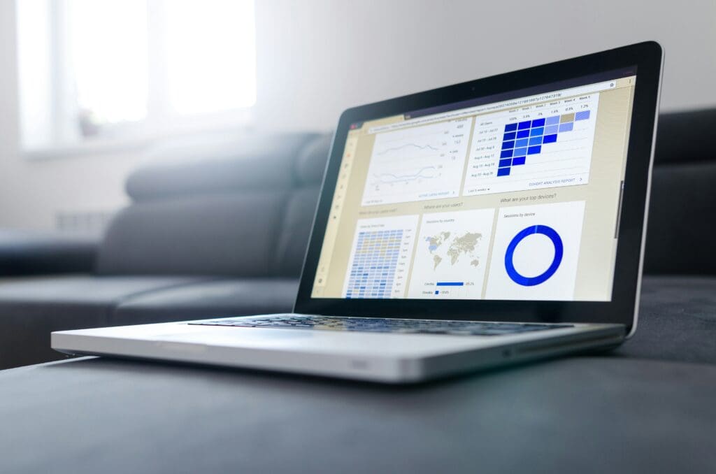 Laptop displaying SEO data charts for understanding keywords